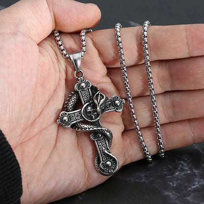 Skull and dragon cross pendant